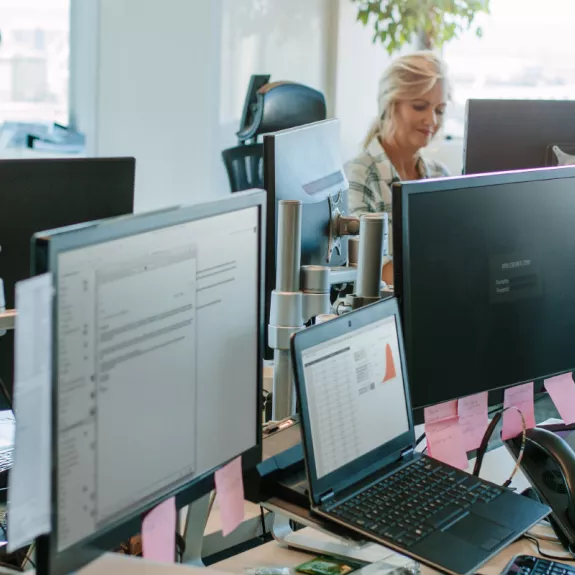 Colleagues working in a busy office